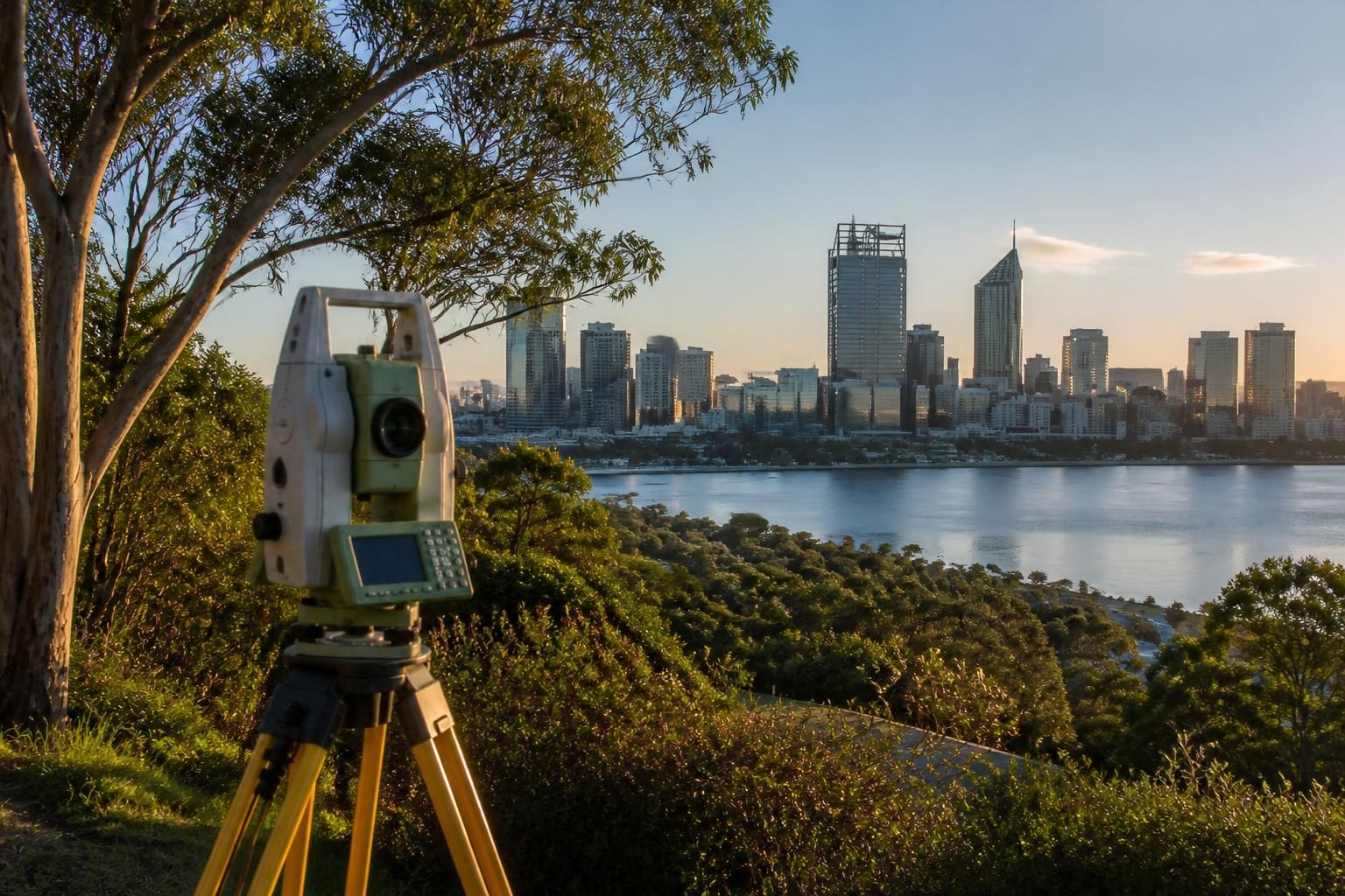 Survey total station overlooking Perth skyline